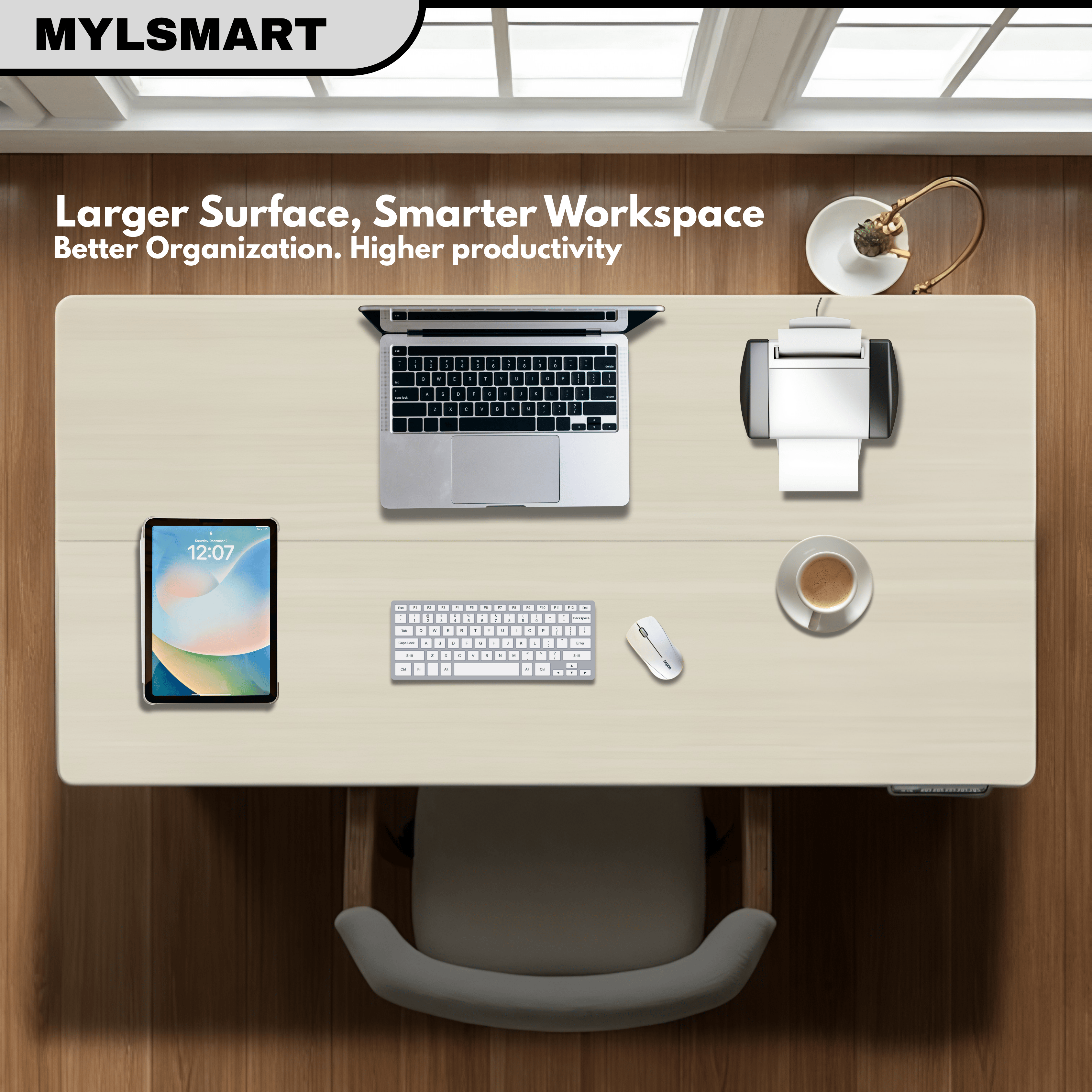 Mylsmart electric height adjustable desk with laptop, tablet, keyboard, mouse, and coffee cup on a wooden desk.